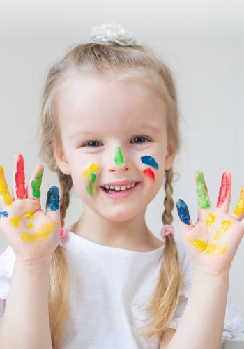 caucasian-little-girl-painting-with-colorful-hands-paints-home-early-education-preparing-school-preschool-development-children-game